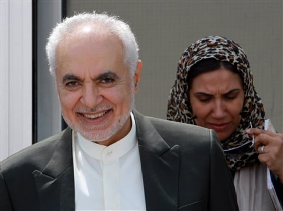 Imam Feisal Abdul Rauf, left, smiles as he leaves the offices of the Bahraini newspaper Al-Wasat in Budaiya, Bahrain, on Sunday, Aug. 22, where he met with local journalists. Rauf, the imam leading plans for an Islamic center near the site of the Sept. 11 attacks on New York, is on a U.S.-funded outreach tour to Bahrain, Qatar and the United Arab Emirates to talk about religious tolerance in America.